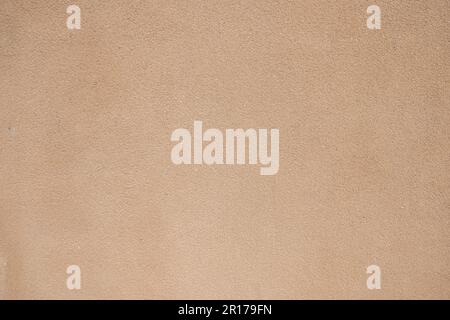 detail of an ochre colored cement coated wall Stock Photo