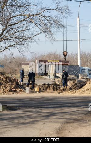 Tiraspol, Moldova - 13, February, 2023: Repair underground storm sewers, water main, sanitary sewer, drain systems in Unrecognized republic Transnistr Stock Photo