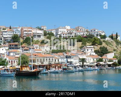 Greece, Island of Samos:  the waterfront at Vathy, with fishing boats moored along its length. Stock Photo