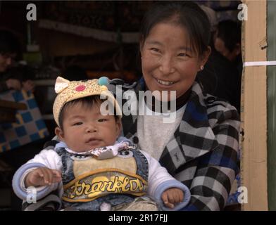 People's Republic of China, Tibet, Gyantse:  proud mother. Stock Photo