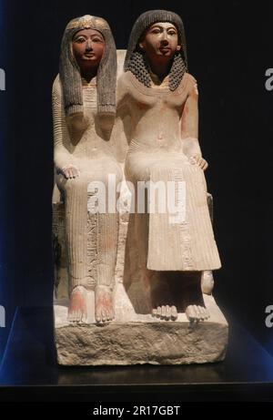 Germany, Upper Bavaria, Munich, State Museum of Egyptian Art:  figures of seated priest, Neye, with his mother, Mutnofret (19th Dynasty, 1250 BC). Stock Photo