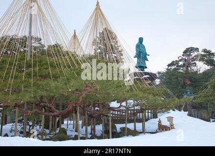 Kenrokuen Garden Meiji Memorial in snow and Black pine trees with ropes around to protect them from snow Stock Photo