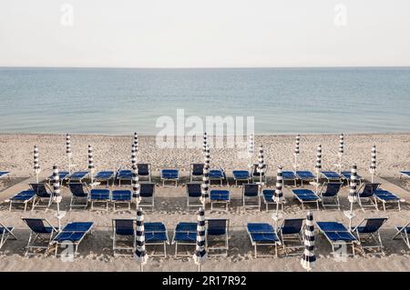 Beach Italy summer morning deck chair empty Stock Photo