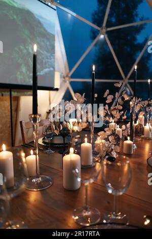 A festive table set for a wedding in a restaurant Stock Photo