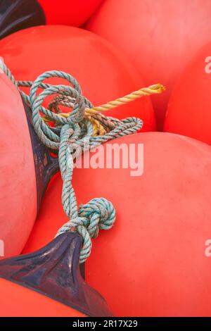 Fishing marker buoys and ropes on shore, beside the harbour at Teignmnouth, Devon, Great Britain. Stock Photo