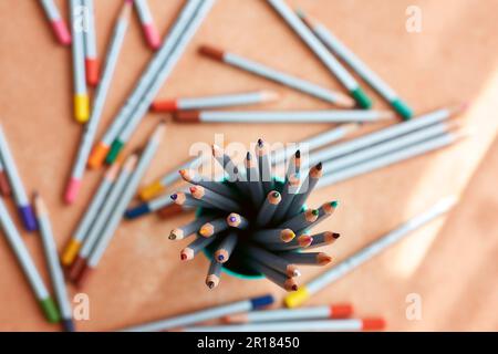 many sharpened colored pencils in a tube top view Stock Photo