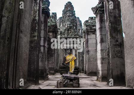 Prasat Bayon with smiling stone faces is the central temple of Angkor Thom Complex, Siem Reap, Cambodia. Ancient Khmer architecture and famous Cambodi Stock Photo