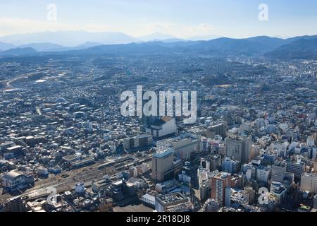 Aerial shot of Hachioji station from northeast towards Takao mountain area. Stock Photo