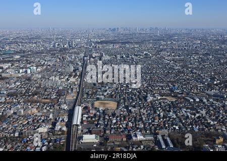 Aerial shot of Higashi-Koganei station from the west towards Ikebukuro,Shinjuku and the Tokyo Sky Tree Stock Photo