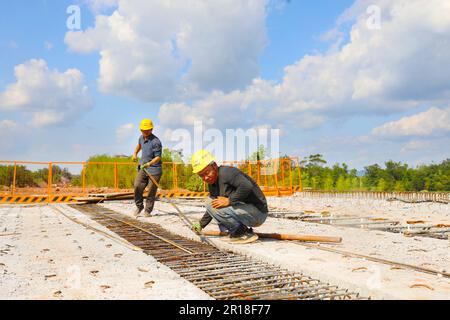 CHONGQING, CHINA - MAY 11, 2023 - Workers work at the construction site of the Qihe Junction of the Liangping to Kaijiang Expressway in Qihe village, Stock Photo