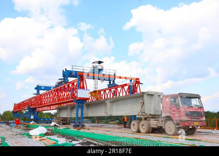 CHONGQING, CHINA - MAY 11, 2023 - Workers work at the construction site of the Qihe Junction of the Liangping to Kaijiang Expressway in Qihe village, Stock Photo