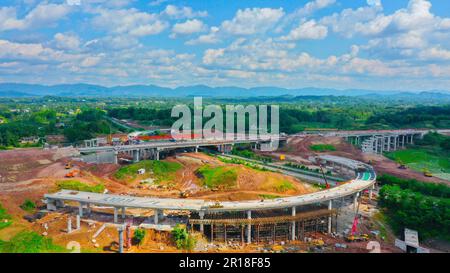 CHONGQING, CHINA - MAY 11, 2023 - Workers work at the construction site of the Qihe Junction of the Liangping to Kaijiang Expressway in Qihe village, Stock Photo