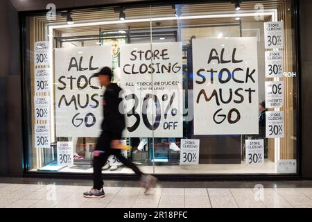 Manchester, Britain. 11th May, 2023. A man walks past a shop in Manchester, Britain, May 11, 2023. The Bank of England (BoE) on Thursday raised its benchmark interest rate by 0.25 percentage points to 4.5 percent, the highest since 2008. Its growth projections for the United Kingdom's (UK) economy were improved and inflation forecasts revised higher. Credit: Jon Super/Xinhua/Alamy Live News Stock Photo