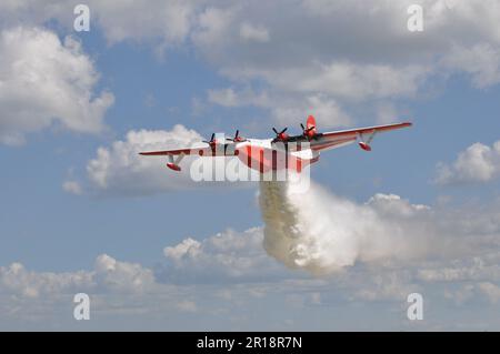 World's largest flying boat dropping water, 77 year old, fights forest fires Stock Photo