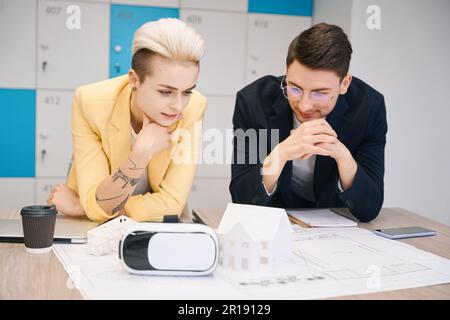 Designers using virtual reality glasses to develop blueprin Stock Photo