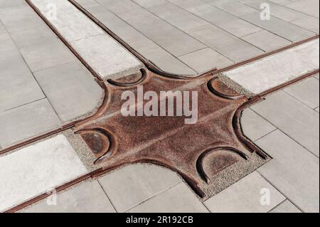 Street tiles with metal ground surface indicators, closeup Stock Photo