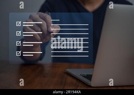 businessman checklist and document on virtual screens concept, business people check electronic digital questionnaire, evaluation, online survey, comm Stock Photo