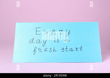 Card with phrase Every Day Is A Fresh Start on pink background. Motivational quote Stock Photo