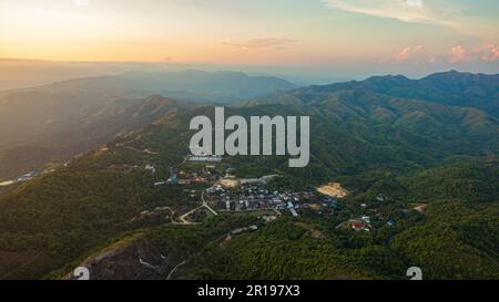 aerial view on the peak in sunset the village far from civilization Traveling on a difficult road. Beautiful sunset view on the hilltop complex. The s Stock Photo