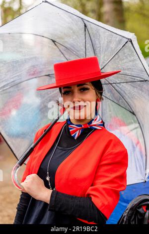 A Young Woman Dressed In Spanish Costume Poses For A Photo In The Mall Before The Coronation of King Charles III, London, UK. Stock Photo