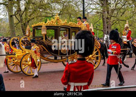 King Charles III and Camilla Queen Consort Wave To The Crowds As They Travel Along The Mall To Westminster Abbey For The Kings Coronation, London, UK. Stock Photo