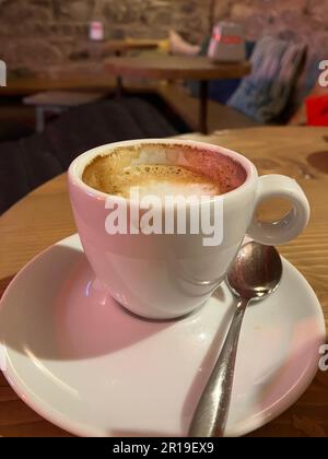 Coffee on Saucer with Spoon Stock Photo