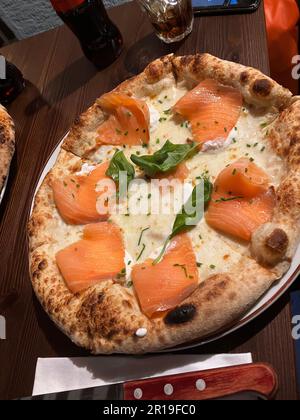 Tasty pizza in a restaurant in Milan Stock Photo