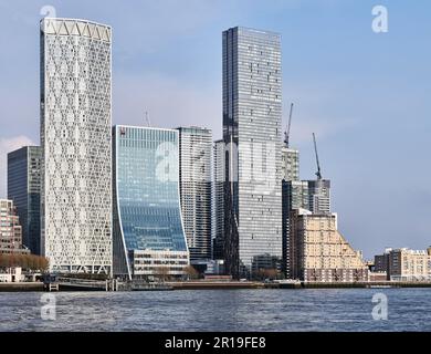 Newfoundland Quay and Landmark Pinnacle skyscraper buildings at the financial district of Canary Wharf, by the river Thames, London, England. Stock Photo