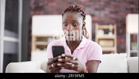 African American Women With Mobile Phone In Hand Stock Photo