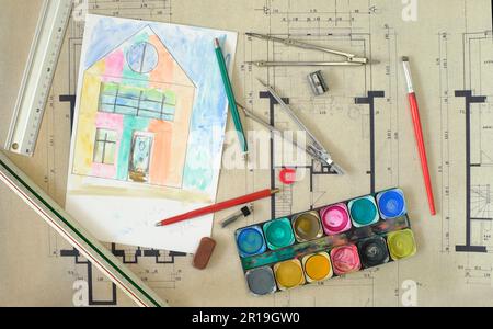 Construction and architecture concept. Residential building drawings and color scheme, flat lay, free copy space. Fictional drawing and painting. Stock Photo