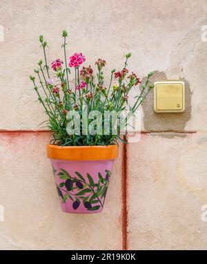 Wall pot decorating a house in Alcudia a walled town on the north-east coast of Majorca Spain Stock Photo