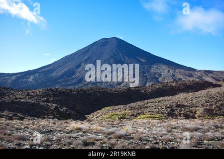 View of the Mt Ngauruhoe (Mount Doom) volcanic cone from the trekking route of the Tongariro Alpine Crossing trail on the North Island of New Zealand. Stock Photo