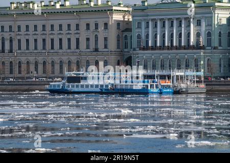 SAINT PETERSBURG, RUSSIA - APRIL 12, 2023: Pier for excursion motor ships (Palace pier) in spring ice drift. Preparation for navigation in St. Petersb Stock Photo