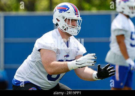 Buffalo Bills offensive lineman O'Cyrus Torrence (64) runs a drill