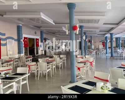 Tables and chairs set decorated in a restaurant cafe bar catering establishment for relaxation in a hotel in a warm tropical eastern country southern Stock Photo