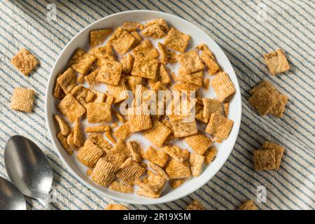 Sweet Crunchy Cinnamon Breakfast Cereal with Milk Stock Photo