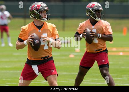 Tampa Bay Buccaneers quarterback Kyle Trask (2) throws as quarterbacks  coach Clyde Christensen watches during the first half of a preseason NFL  football game against the Miami Dolphins, Saturday, Aug. 13, 2022