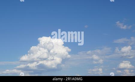 Cumulus white cloud on blue sky in summer beautiful day Stock Photo