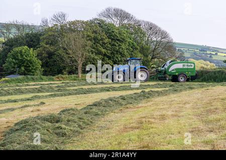 Timoleague, West Cork, Ireland. 12th May, 2023. Barry Long of Eoin Coomey Agri & Plant LTD, bales grass for Timoleague-based farmer John Michael Foley using a New Holland T7.245 tractor and McHale Fusion 3 Plus baler. Credit: AG News/Alamy Live News Stock Photo