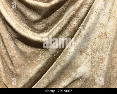 Decorative relief plaster imitating stones on wall. Stock Photo