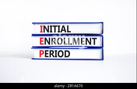 IEP symbol. Concept words IEP Initial enrollment period on beautiful books. Beautiful white table white background. Medical and IEP Initial enrollment Stock Photo