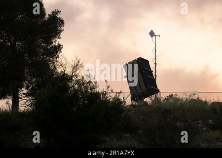 Jerusalem, Israel - May 6th, 2022: An Iron Dome anti rocket battery, deployed in the Judea mountains, near Jerusalem, Israel, at dusk. Stock Photo