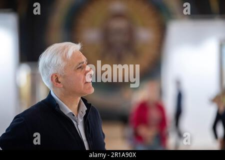 Moscow, Russia. 12th May, 2023. Artist Vasily Nesterenko at the exhibition of his works 'We are Russians, God is with us!' in the Central Exhibition Hall 'Manege' in Moscow, Russia. Stock Photo