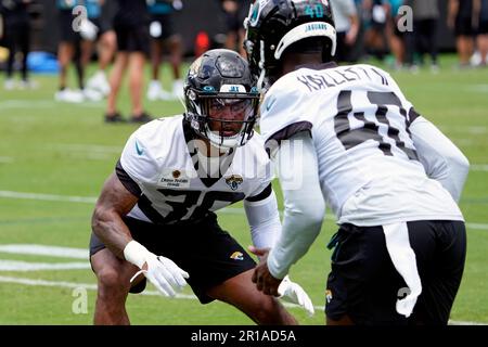 Jacksonville Jaguars cornerback Christian Braswell (36) and Dallas Cowboys  wide receiver Jose Barbon (14) pose for