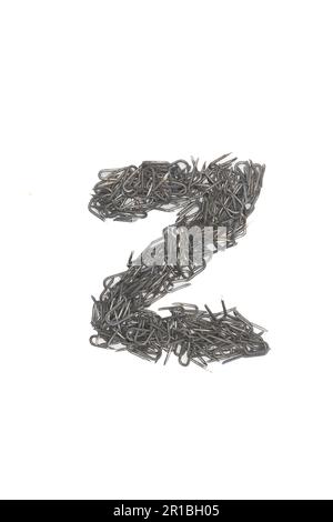 artistic isolated Letter z made from steel staples isolated on a white background write, font, type style, Stock Photo