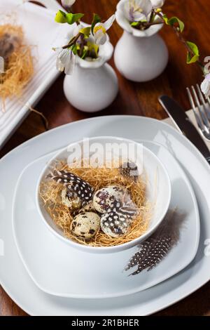 Easter place setting with quail eggs Stock Photo