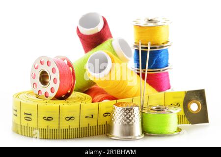Composition with tailor needles and threads over white background Stock Photo
