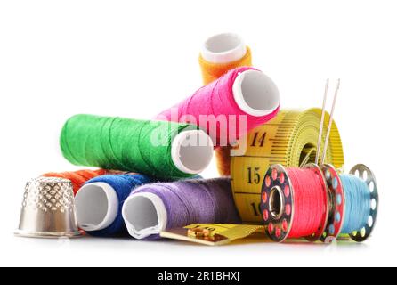 Composition with tailor needles and threads over white background Stock Photo