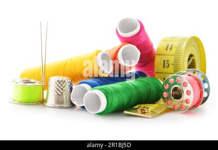 Composition with tailor needles and threads over white background Stock Photo