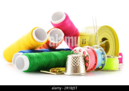 Composition with tailor needles and threads over white background Stock Photo